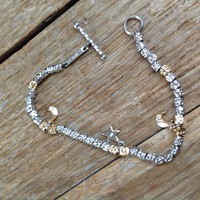 Silver bracelet with 3 pieces of brilliant stones
