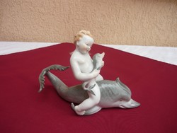 A little boy riding a Herend dolphin, now for 1 forint