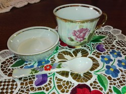 22 K. Porcelain coffee cup decorated with gold, eosin pattern, placemat plate with spoon.