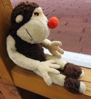Old monkey plush figurine