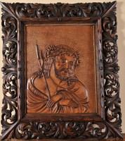 Portrait of suffering Jesus Christ, carved relief