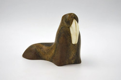 Vintage, marble-carved, polished stone figurine (walrus) with leaf weights and quartz fangs.