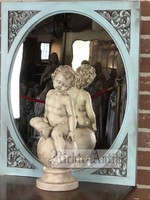 Vintage antique angel statue with putto.