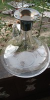 Beautiful sterling silver - glass decanter pouring