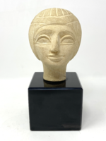 Ceramic statue depicting an Egyptian head on a glass pedestal - cz