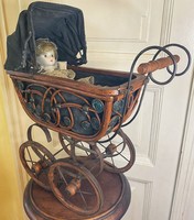 Antique stroller with baby.