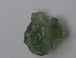 Olive green Moldavian meteorite grain. Rare natural glass, for collection or jewelry.