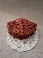 Old sparse small wicker candy storage table decoration with old crochet fishnet tablecloth