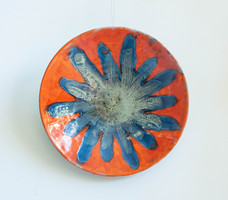 Marked lux elek retro ceramic wall plate - blue star with floral pattern on a red background