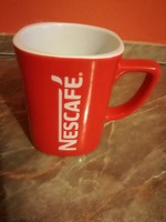 Red porcelain mug with Nescafé inscription