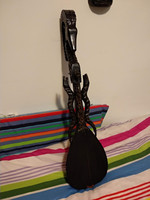 Black, chamois, horse-head carved wooden folk instrument, guzla wood carving