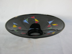 Retro ... Black glass bowl with colorful patterns as a table centerpiece