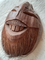 Egy eredeti kókusz vigyor valamelyik déltengeri szigetről kókuszdióból faragott maszk falidísz