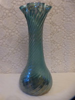 Old iridescent broken glass vase.