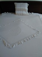 Old linen bedspread for blankets or linens in the clean room!