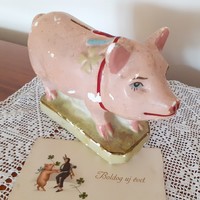 Old piggy bank lucky pig clover pig painted plaster figure damaged