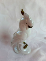 Snow-white porcelain cockatoo with gold painting