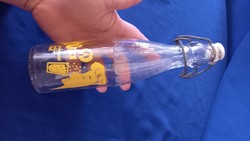 Citromsárga Hüsi üdítős üveg