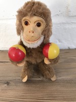 Old automatic winding toy monkey working