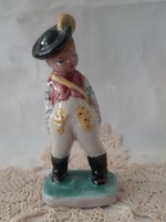 Hand-painted, perky hop ceramic lad in traditional costume