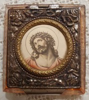Glass rosary and box holding a christ worship item