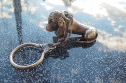 Dachshund (plain) mini statue keychain unfortunately I do not know the material but the magnet does not