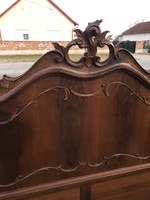 Antique double bed with bed frame.