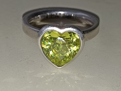 Silver lumani sterling silver ring with olive green heart shaped zircon stone.