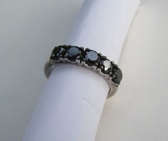 Shiny silver ring with five black stones