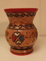 Small wooden ornate colored vase
