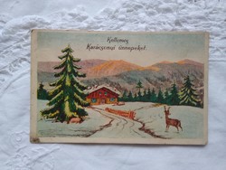 Régi grafikus karácsonyi képeslap, havas táj, szarvas, fenyőerdő 1937