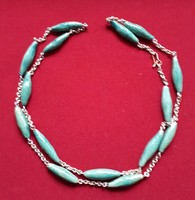 Chain with green minerals