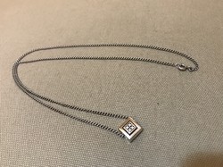 Silver necklace with fossil pendant