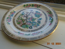 Decorative oriental flower pattern on english plate with sampsonite churchill