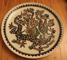 Seven-headed dragon painted in a glazed ceramic wall bowl