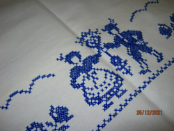 Old blue cross-stitch embroidered linen tablecloth