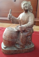 Oriental wooden sculpture depicting a drummer