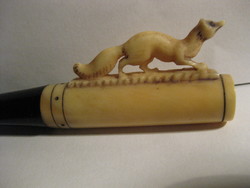 Antique carved bone and vinyl cigarette butt fleeing fox motif unused