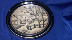 Winter landscape depicting goblein in an oval black frame