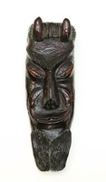 Carved devil's head, grotesque wall mask made of wood