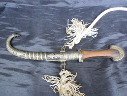 19th Moroccan jambiya, oriental dagger, in richly chiselled case, with wooden handle, ornamental twine.