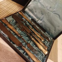 Silver-handled knives forks in a box