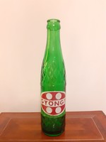 Retro pearl soft drink in old green bottle
