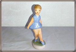 Very beautiful craftsman in a blue dress ceramic girl, ballerina
