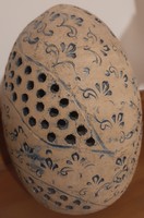 Openwork floral pattern with unglazed ceramic eggs
