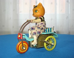 Retro pull-up cyclist cat playing with plate