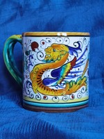 Italian majolica mug decorated with vintage hand-painted raffaellesco patterns