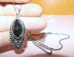 Faceted midnight black stone floral necklace with pierced lace like. With a chain