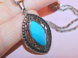 Faceted turquoise blue stone ornate necklace with pierced lace. With a chain