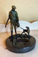 About a forint - a hunter with his dog - a bronze sculpture